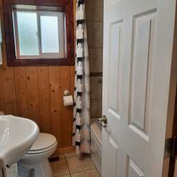 Compact bathroom with soaker tub