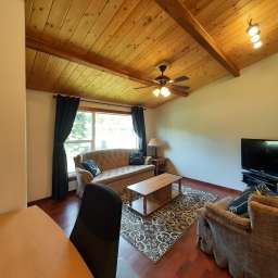 Cozy living space with office area and TV
